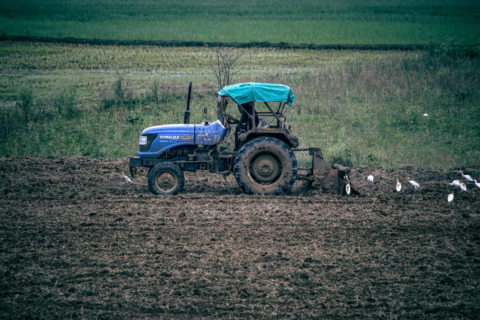 New Holland tractor working in an Indian field